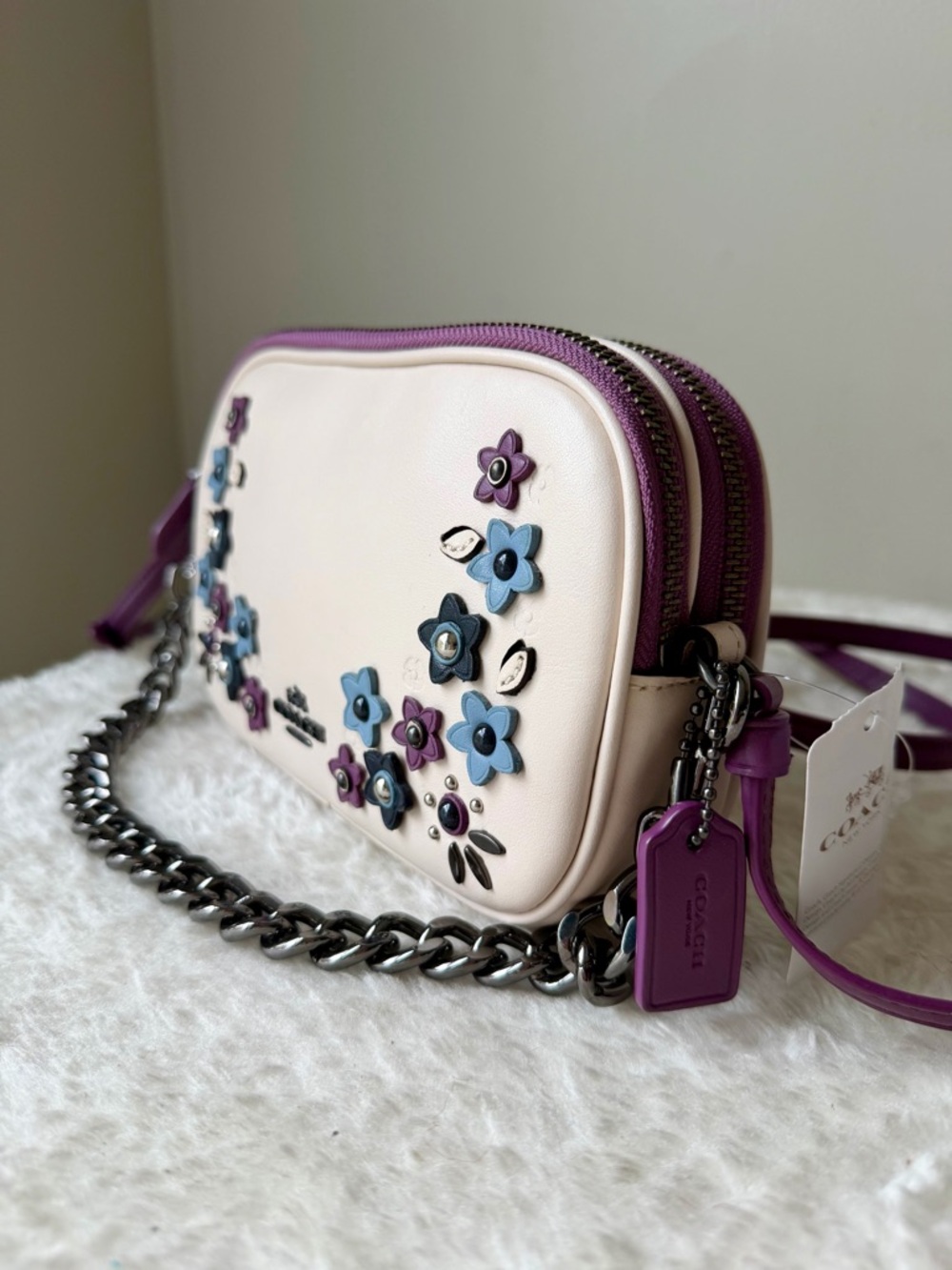 NWT Coach bag crossbody with lavender floral appliqué and chain charm